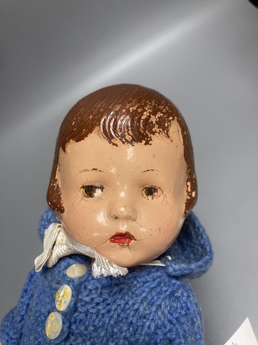 An Armand Marseille bisque boy doll, mould 990 with fixed glass eyes, 30cm, a bisque doll with jointed composition body, 47cm and a pai